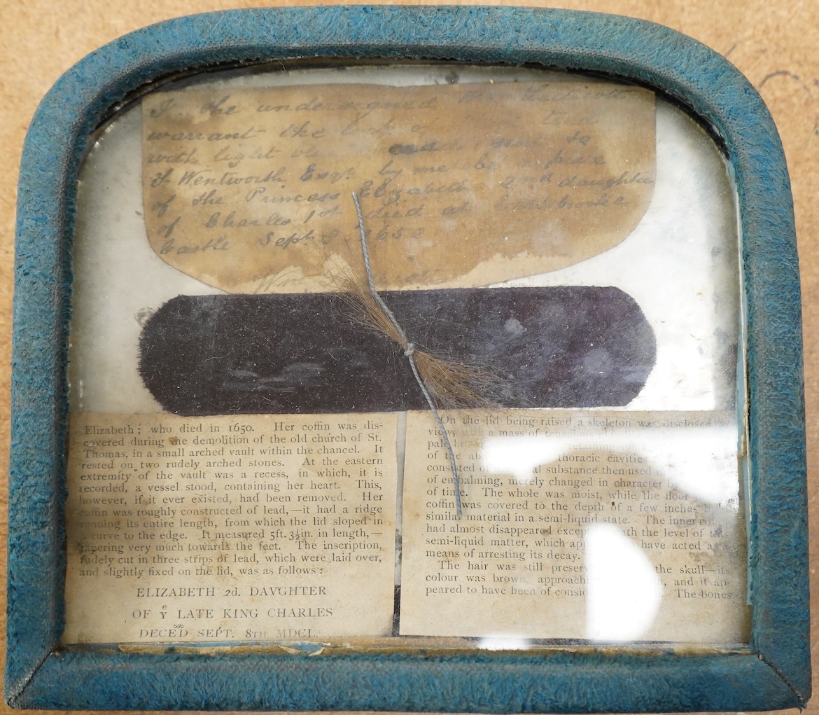 By repute, a lock of hair taken from the body of Princess Elizabeth Stuart (28 December 1635 - 8 September 1650), believed to have been removed from her exhumed remains in the mid 19th century, framed and sold at that ti